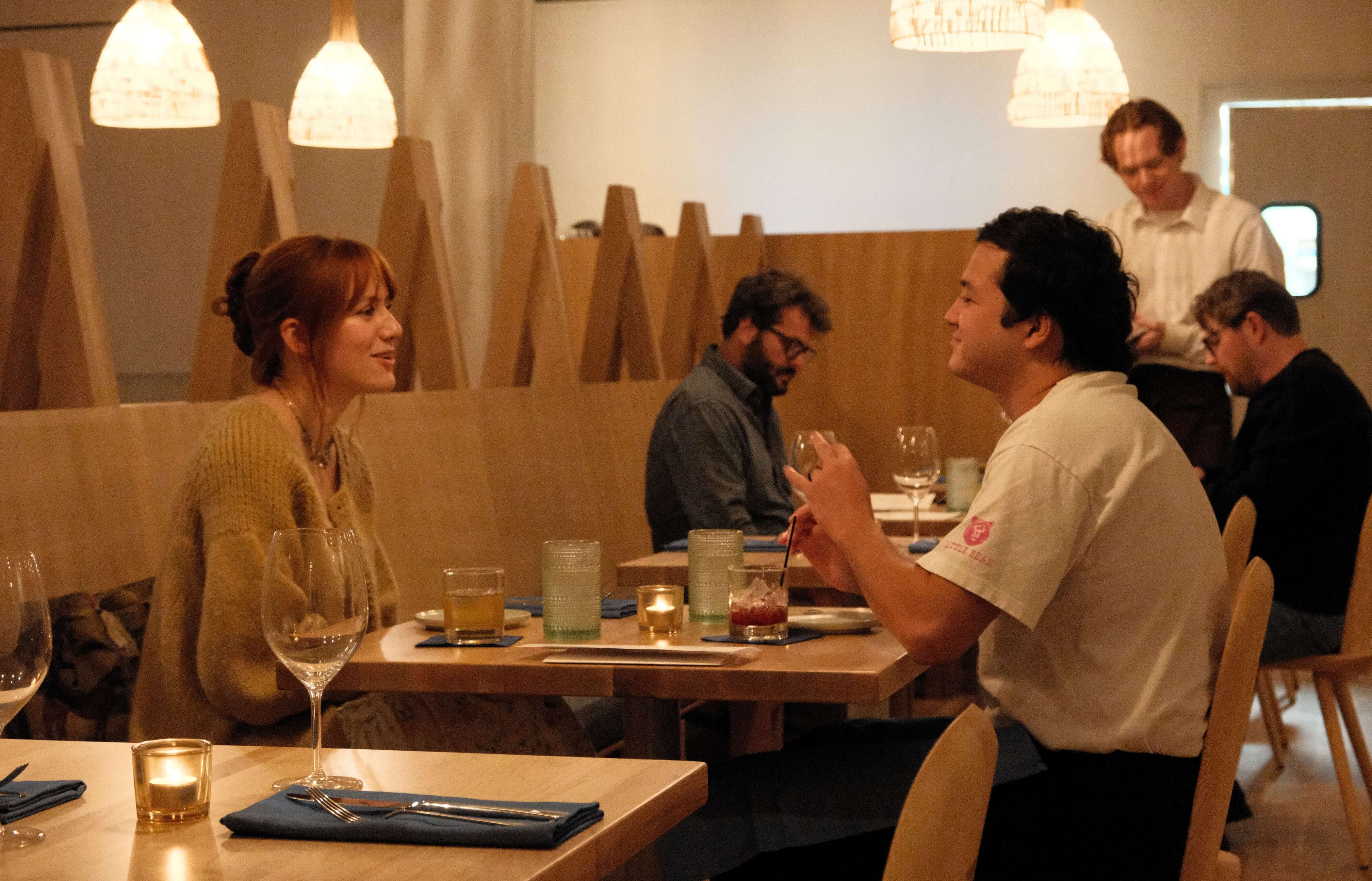 A couple dining at The Restaurant in Stonebreaker Hotel, enjoying an elegant dinner setting.