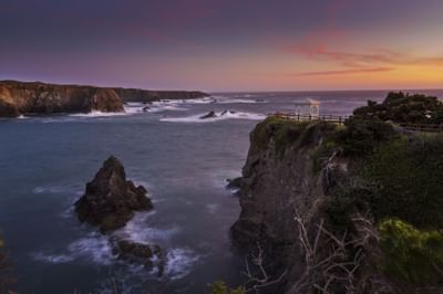 Aerial view of coastline at sunset at Heritage House Resort