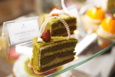 Close-up of mocha cake display at Hanoi Daewoo Hotel