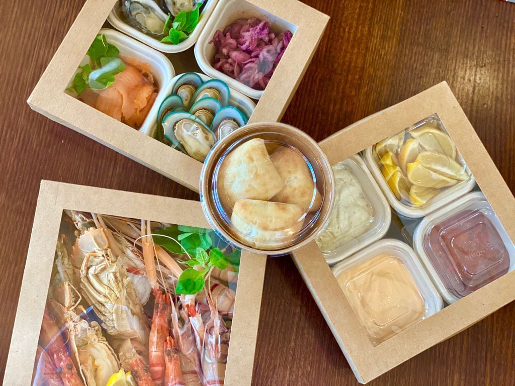 Seafood served in boxes at Bacar Pullman Sydney Olympic Park