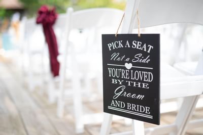 Closeup of chairs in a wedding ceremony at True Blue Bay Hotel