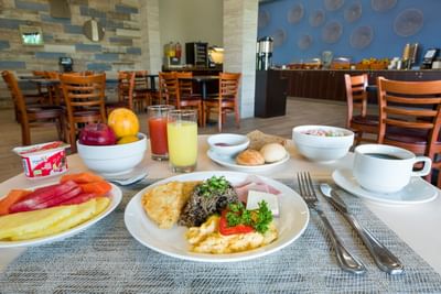 Morning breakfast with fruits, pastries & beverages served in the dining room at Irazu Hotel