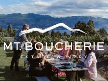 People sitting around a table at Mt. Boucherie Estate Winery.