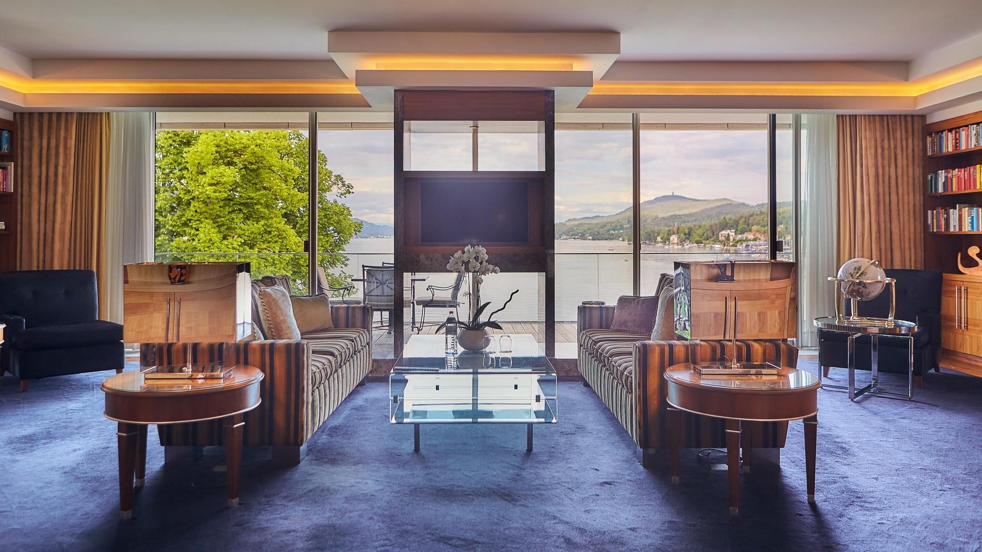 Infinity Suite lounge with a lake view at Falkensteiner Hotels