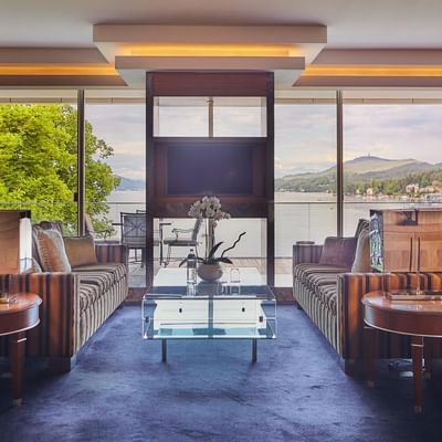 Infinity Suite lounge with a lake view at Falkensteiner Hotels