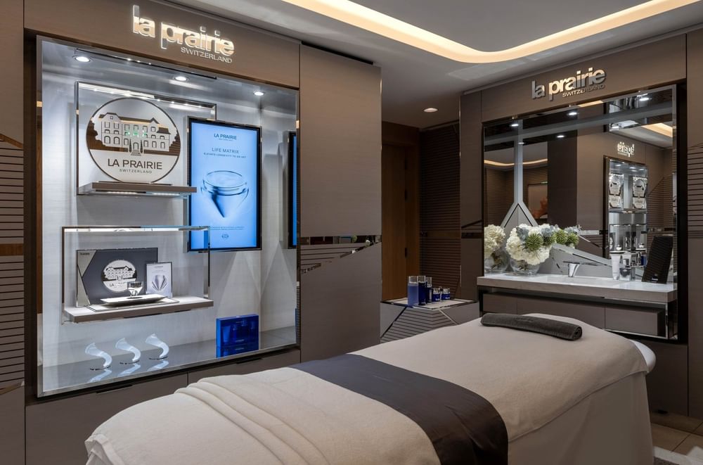 Massage bed, by La Prairie products, under lights in spa at The Capital Hotel, Apartments and Townhouse