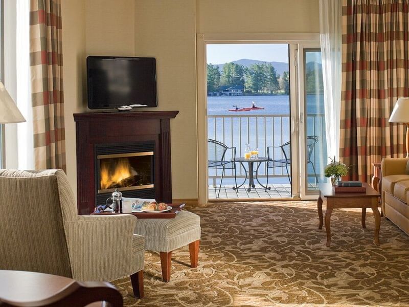 Living area of One Bedroom Suite with a TV and a private balcony at High Peaks Resort