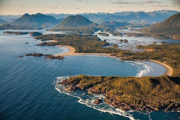 Aerial shot of the sea and mountains in Tofino