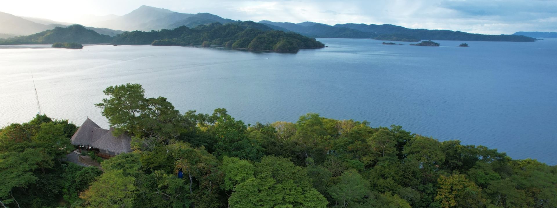 Aerial view of the hotel surrounded by trees at Isla Chiquita Glamping Hotel