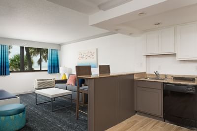 a kitchen area in a hotel room