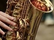 Close-up of a man playing Saxophone, Fiesta Americana Travelty