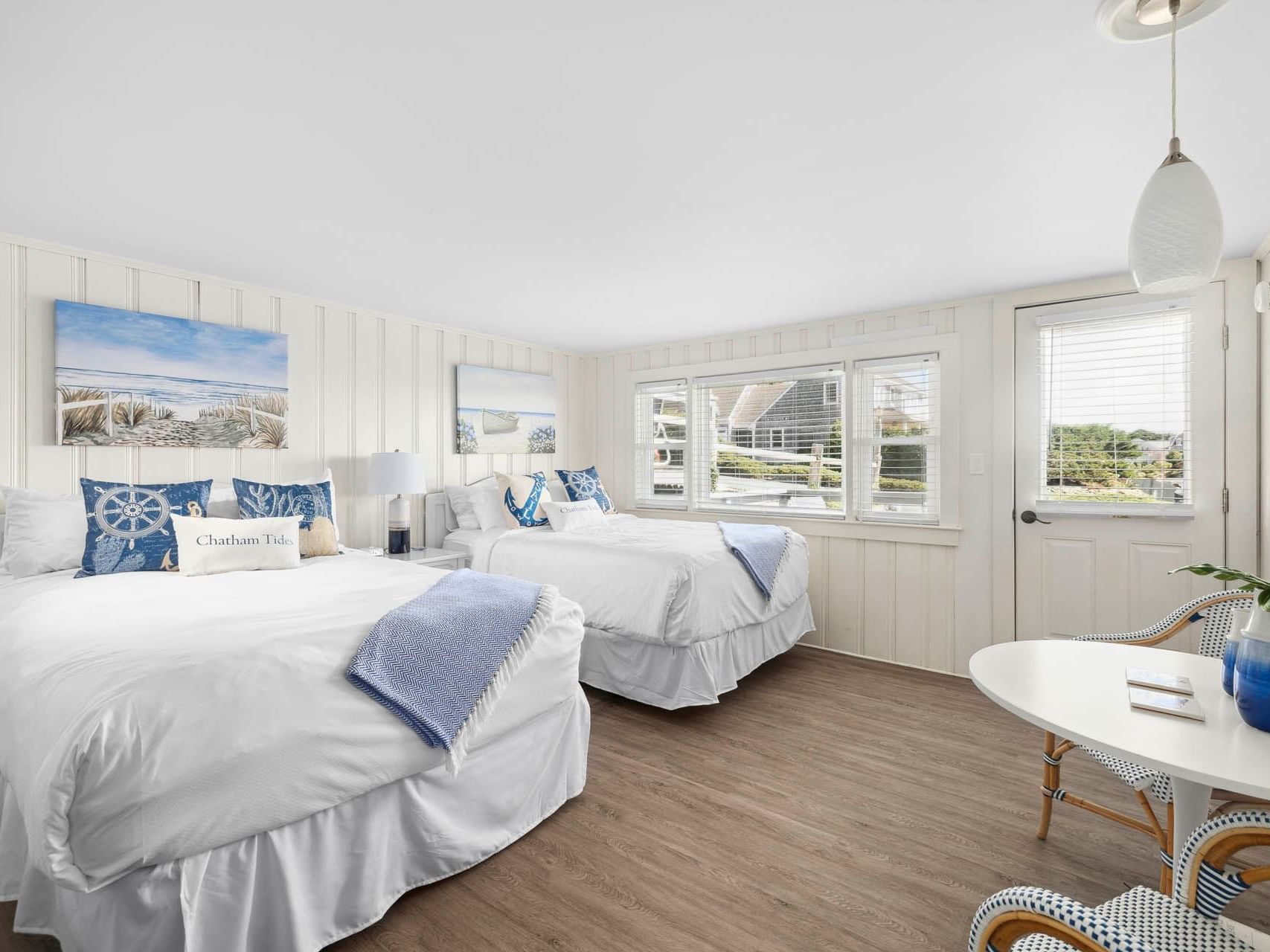 Two beds by seating area in Risingtide Oceanview Double Efficiency at Chatham Tides Resort