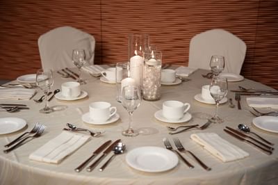 Table arranged with cutlery & glasses at Matrix Hotel