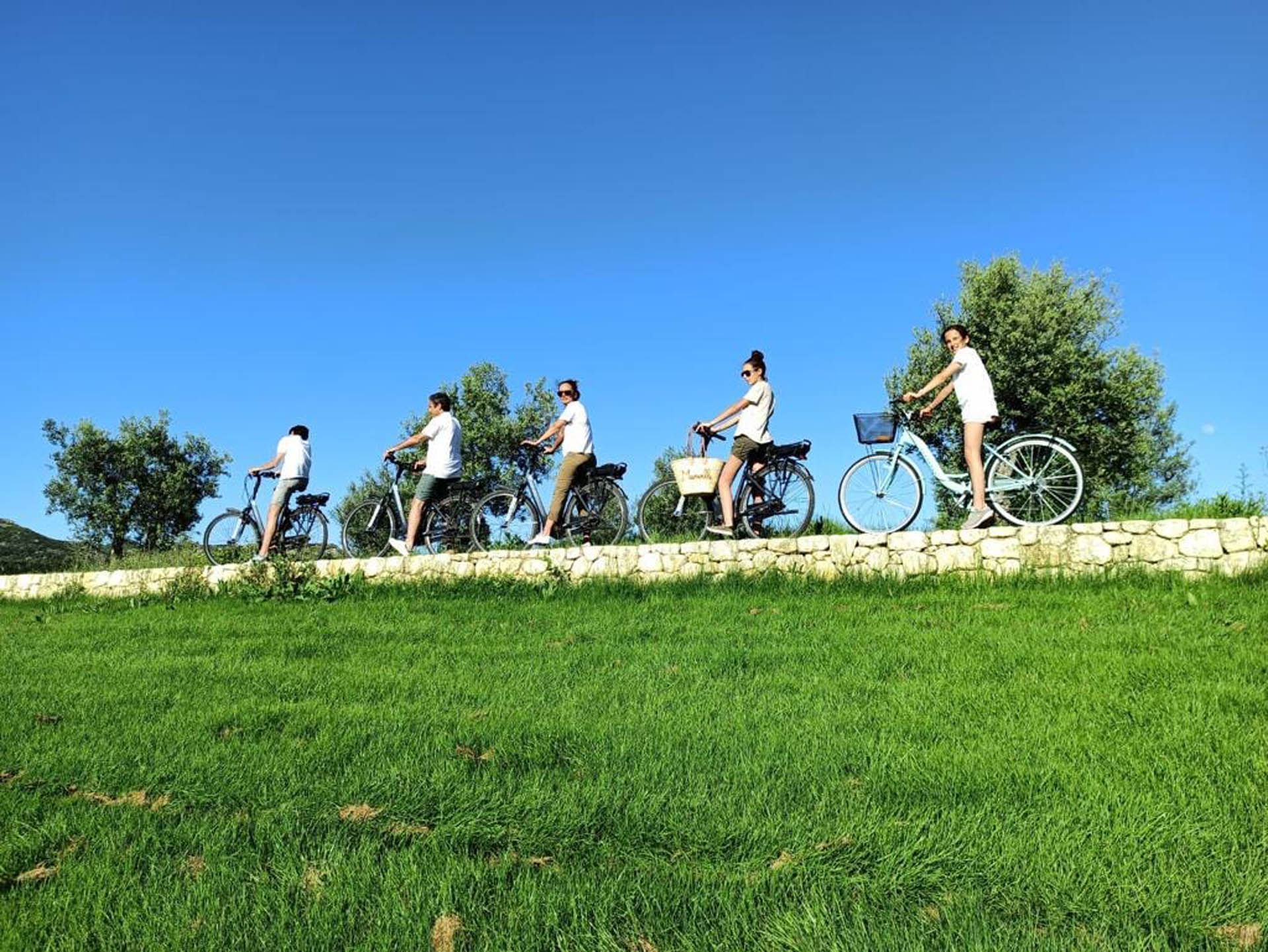 People riding bicycles near Domaine de Manville