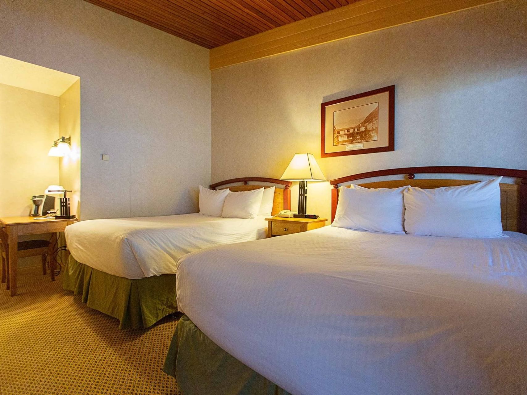 Cozy beds arranged in Classic 1 Queen at Fairmont Hot Springs Resort