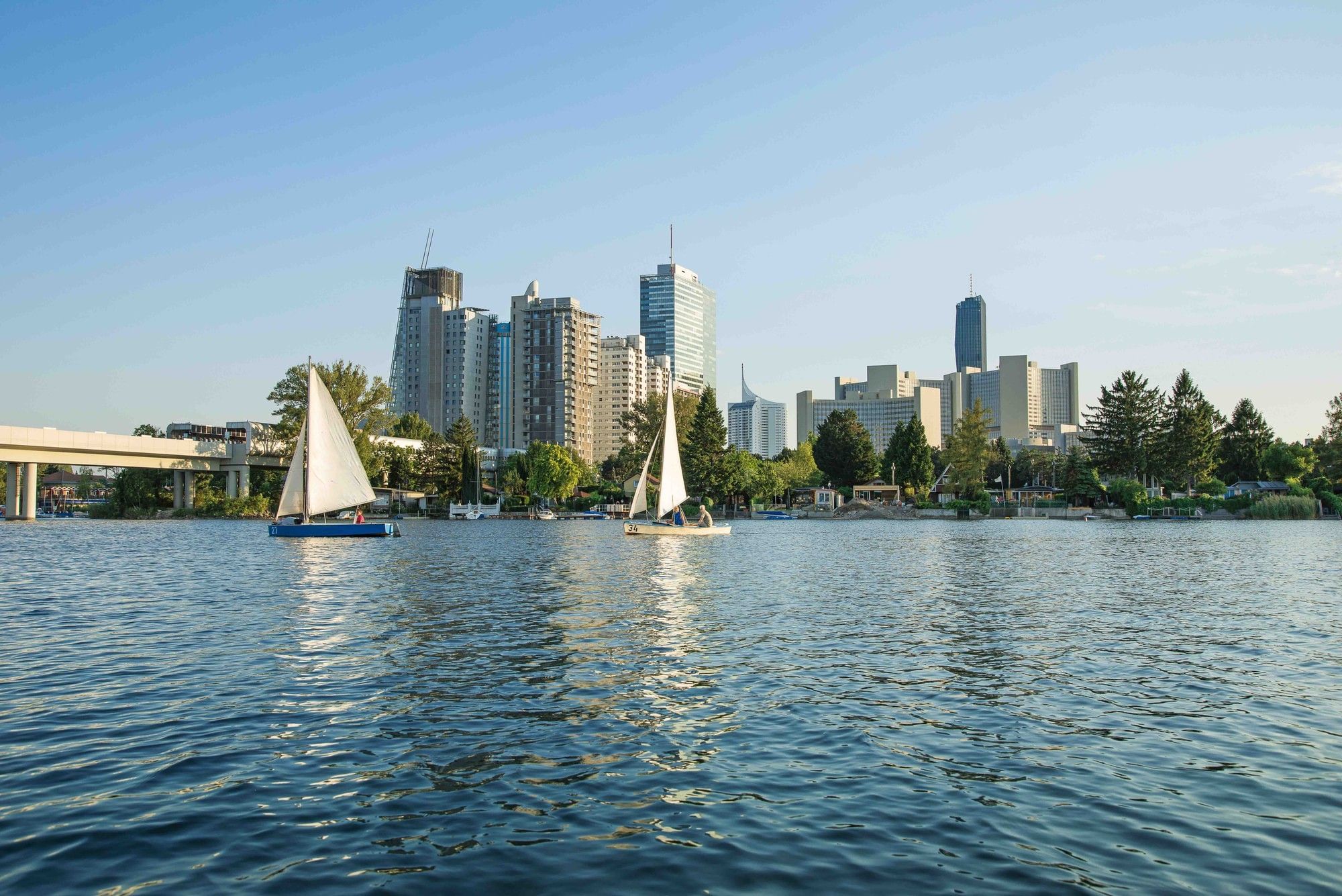 Sailboats on the Old Danube with the modern Donau City skyline in the background
