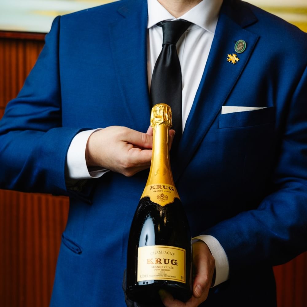 Some holding Wine