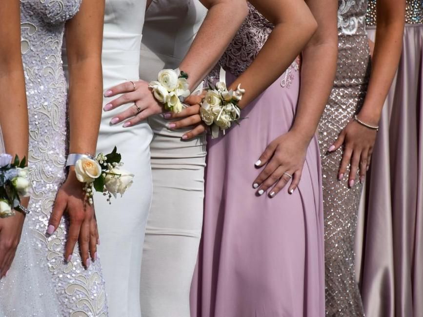 Girls posing in their prom dresses at Gorse Hill, one of the best prom venues in Surrey