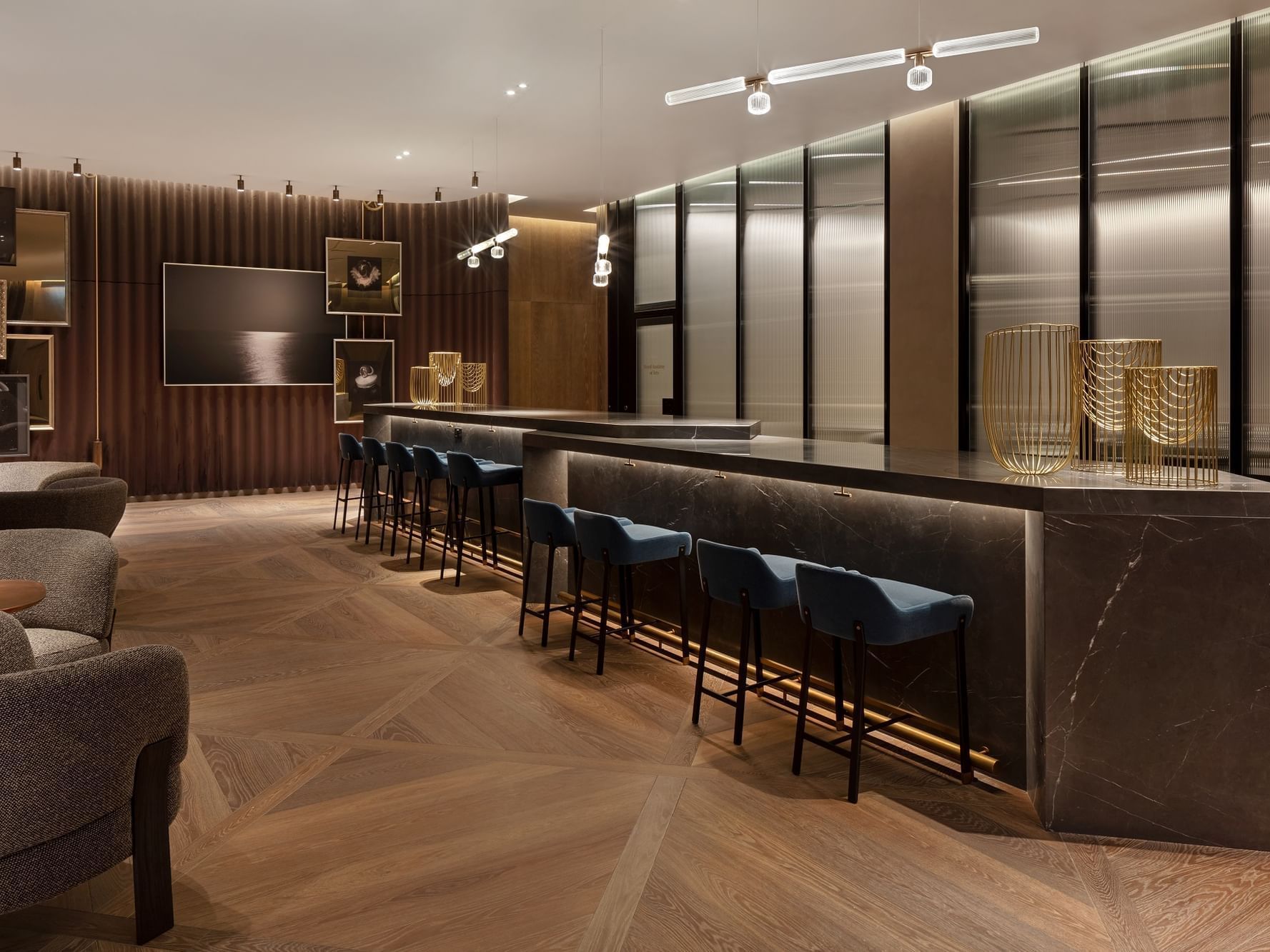 Interior of The Gallery with bar seating at The Londoner Hotel