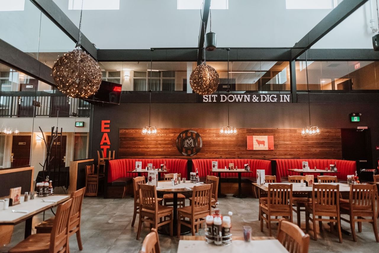 Montana's restaurant with tables and chairs under decorative lights.