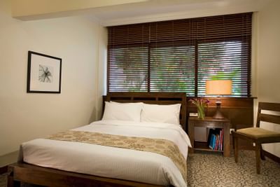 Well-arranged bed in Cabana with carpeted floors at York Hotel Singapore