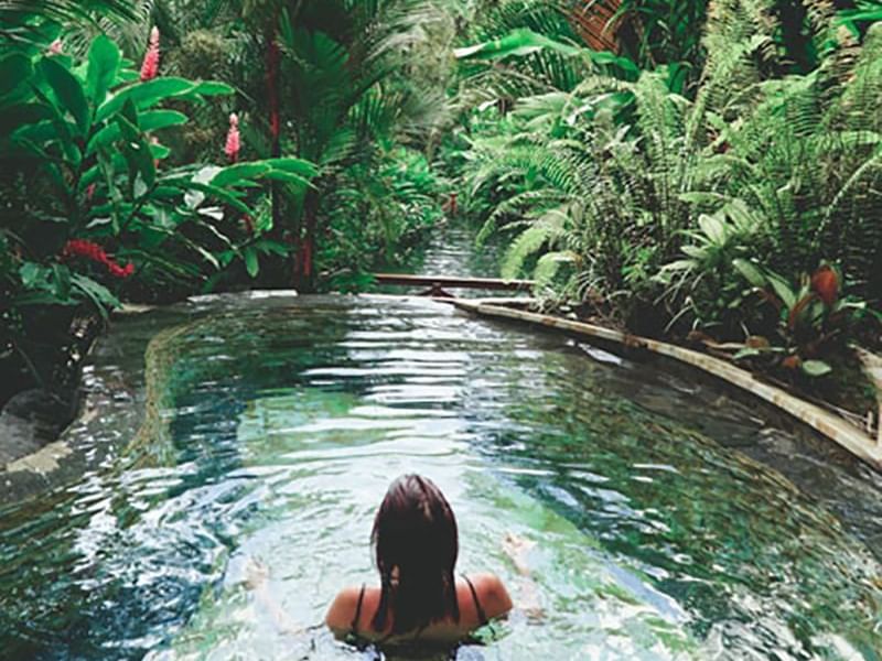 A Lady relaxing in a natural pool near Retreat Costa Rica