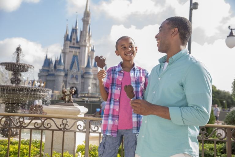 Father & son posing by Disney Hollywood Studio near Lake Buena Vista Resort Village & Spa