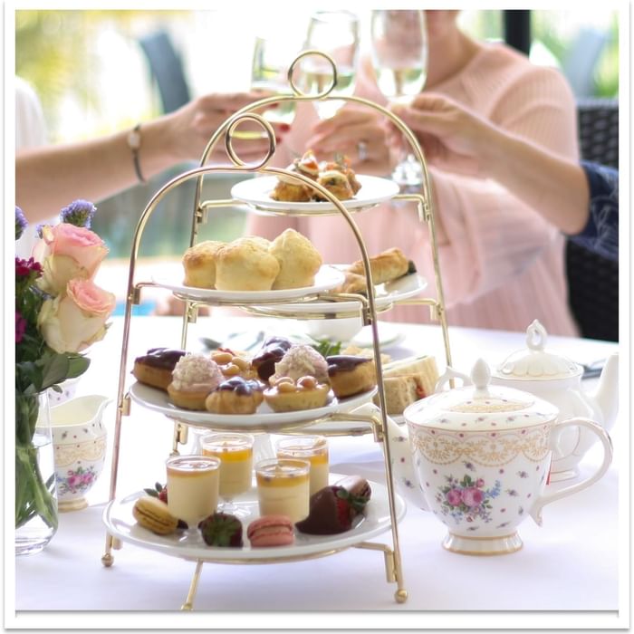 Three-tiered tray with desserts and drinks at Mercure Charlestown.