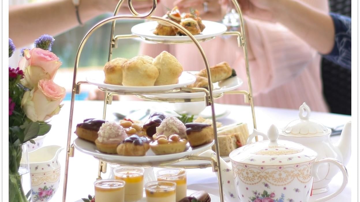 Three-tiered tray with desserts and drinks at Mercure Charlestown.