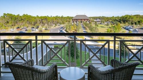 Balcony lounge area overlooking the carpark in Queen Room With Balcony at Camp Creek Inn