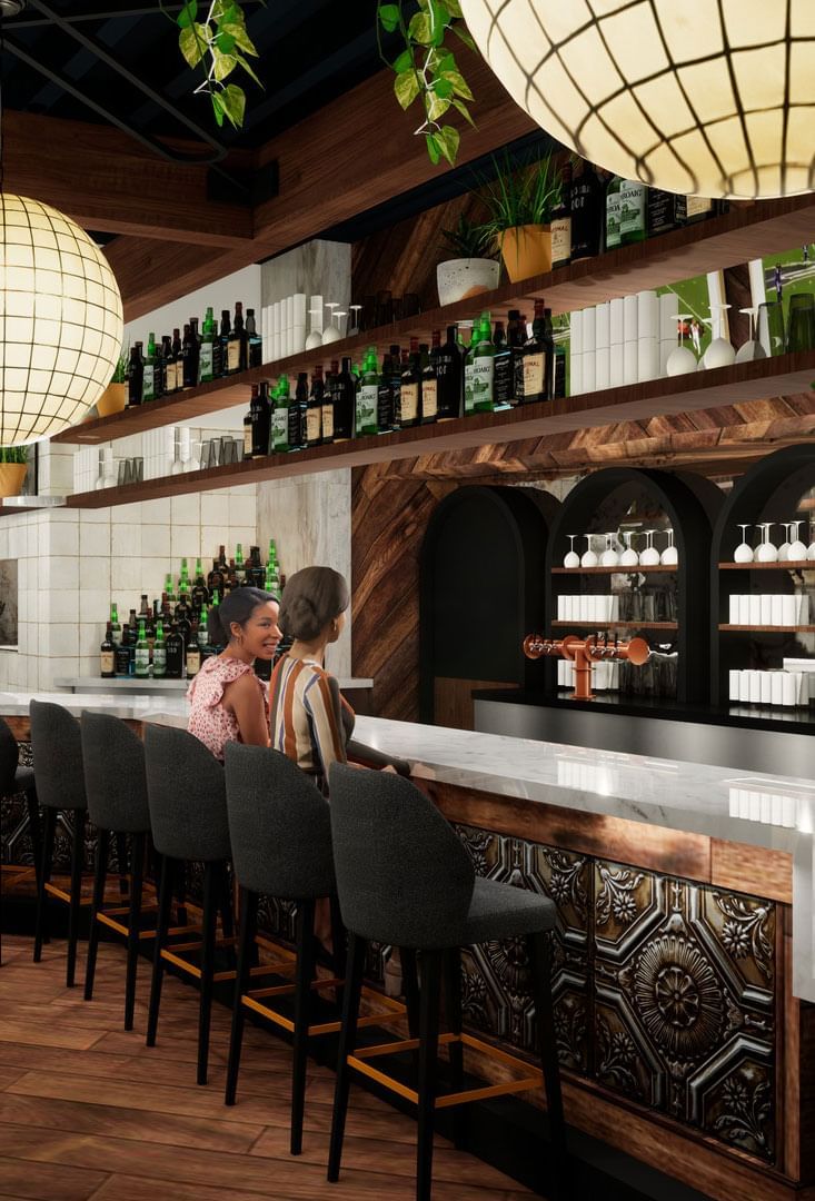 Two people in the bar at Hotel Saint Clair