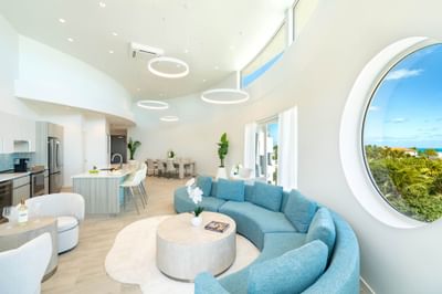 Modern open plan living space with ocean view at Ellipse Grace Bay