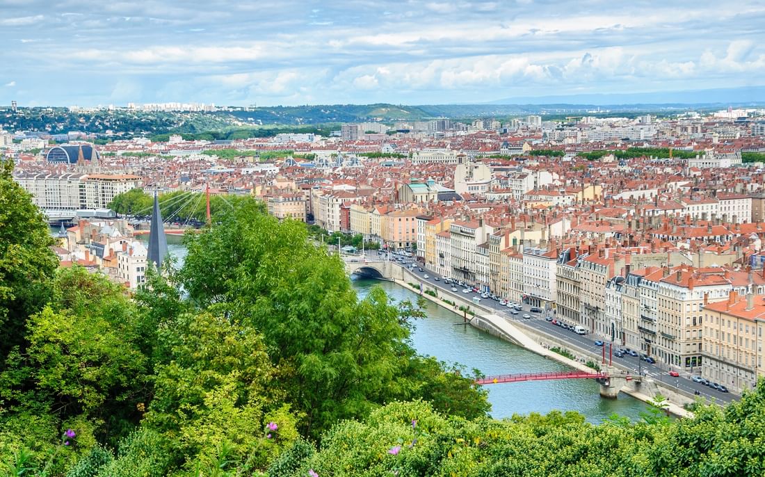Panoramic view of the Saône river and red Passerelle du Palais de Justice near Warwick Lyon