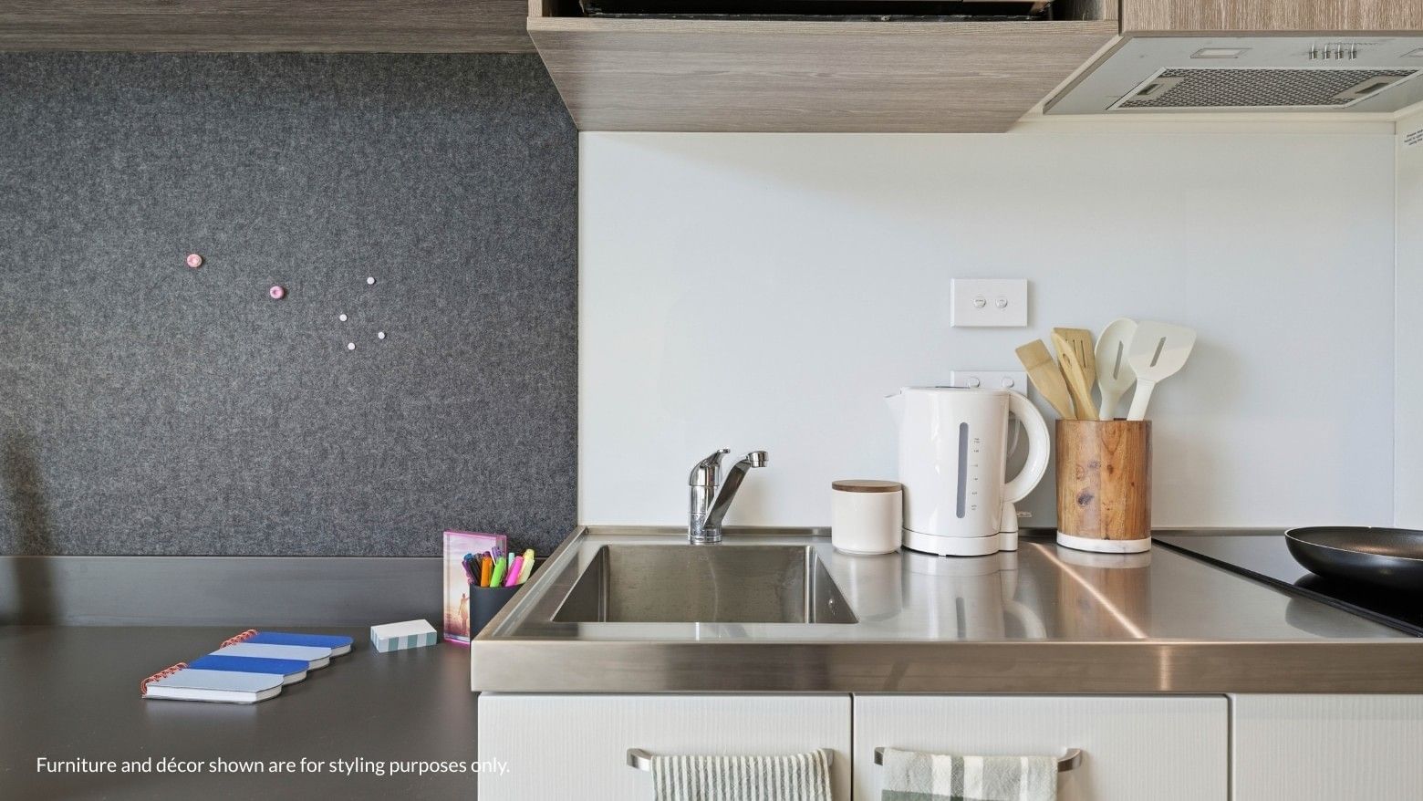 Modern kitchen sink with appliances and utensils at Mayoral Drive Student Accommodation.