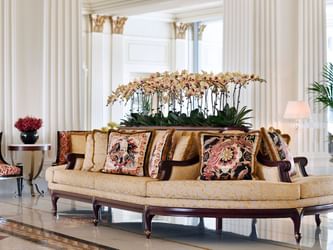 Sofa & flower decorations in the lobby at Palazzo Versace Dubai
