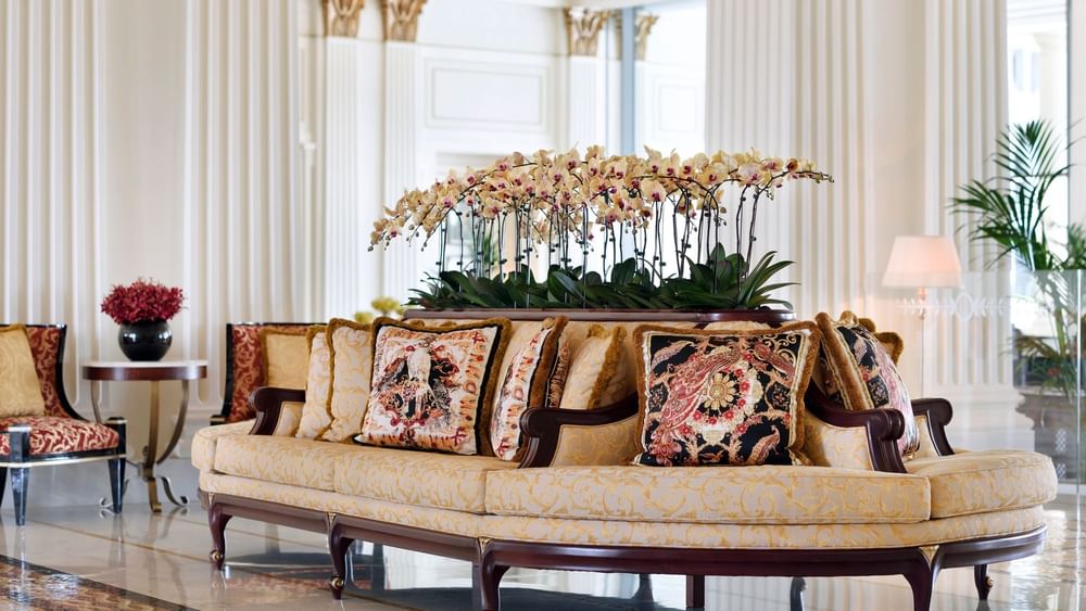 Sofa & flower decorations in the lobby at Palazzo Versace Dubai