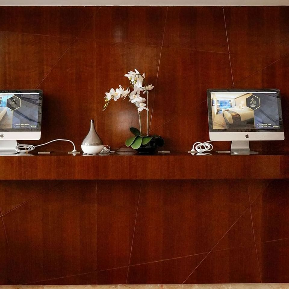 Wooden work desk with computers in Bussiness Center at LK Pandanaran Hotel & Serviced Apartments