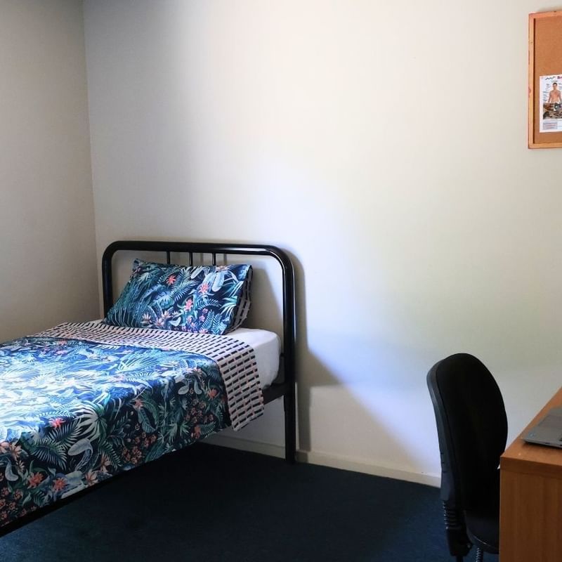 Room with bed, desk, and chair at La Trobe University - Villas.