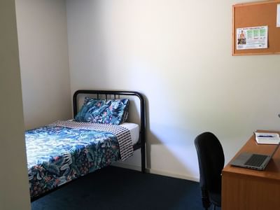 Room with bed, desk, and chair at La Trobe University - Villas.