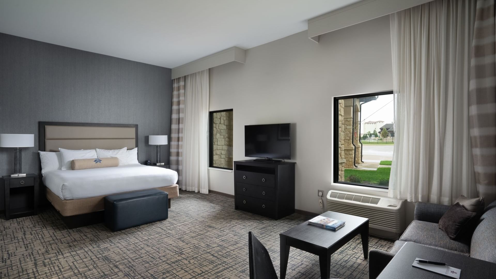 King Studio room with a king bed and seating area at Shangri-La Monkey Island