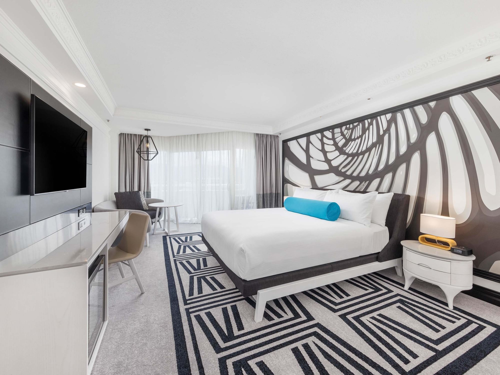 Cozy Bed & decor in Deluxe Harbour View Room at Pullman Cairns