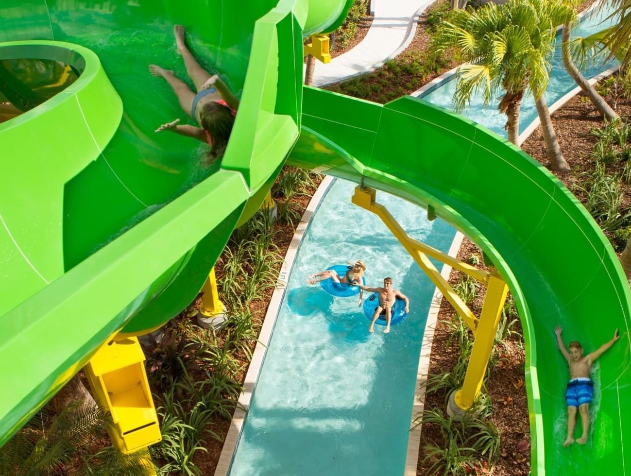 People enjoying a waterslide in Surfari Water Park at The Grove Resort & Water Park