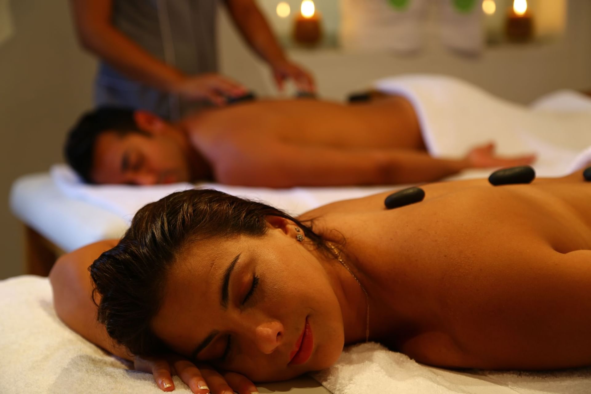 Dunas Spa featuring two individuals receiving hot stone massages at Las Dunas Resort Ica