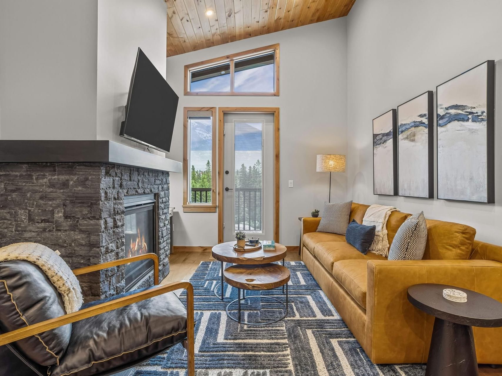 407 Timberstone Lodge One Bedroom Elevated Condo living area with a fireplace, sofa, and wall art at Spring Creek Vacations