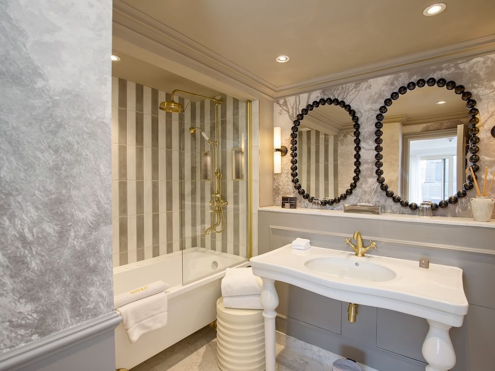Elegance of the bathroom with marble and striped designs in Penthouse at The Capital Hotel Apartments & Townhouse