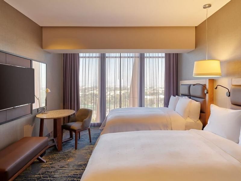 TV & beds in Deluxe Room 2 Double at FA Hotels & Resorts