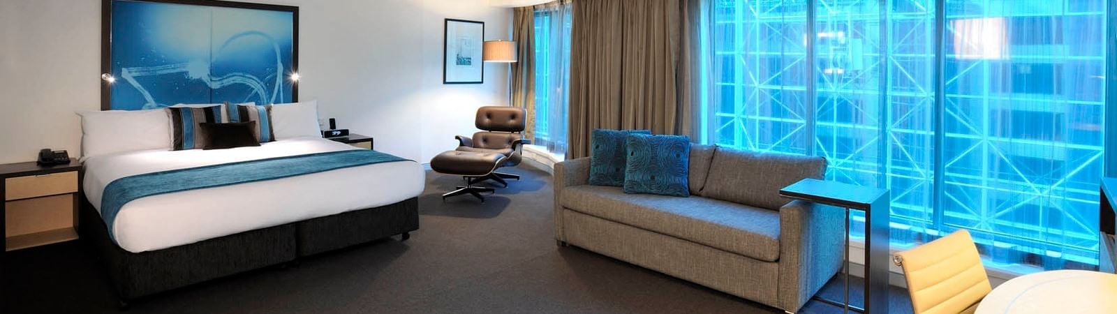 Interior of room with king bed at Novotel Melbourne on Collins