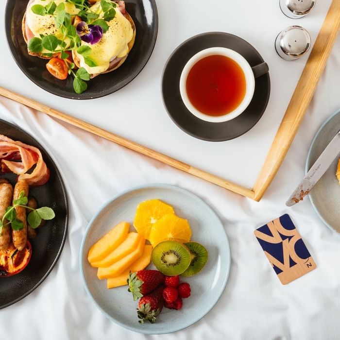 Breakfast served on the bed in a Room at Novotel Glen Waverley