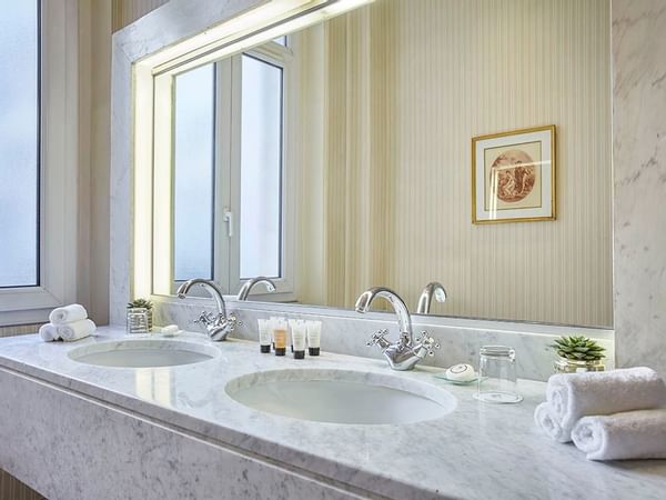 The bathroom vanity area in a suite at Warwick Paris