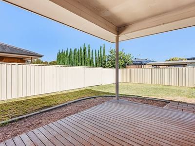 Wooden deck with an open roof and a fenced backyard at La Trobe University Regional Housing Mildura.